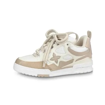 A cream and beige low-top sneaker with a star panel on the side, photographed against a plain white background.